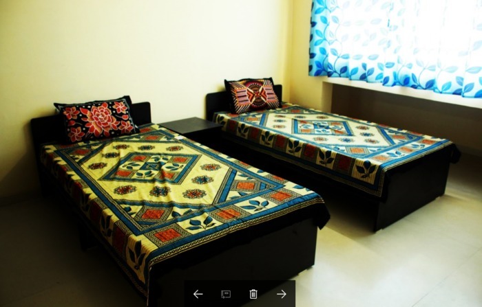 Rishab's Nest 3 BHK Apartment Bedroom 1