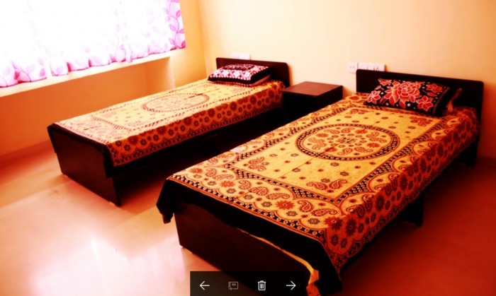 Rishab's Nest 3 BHK Apartment Bedroom 2